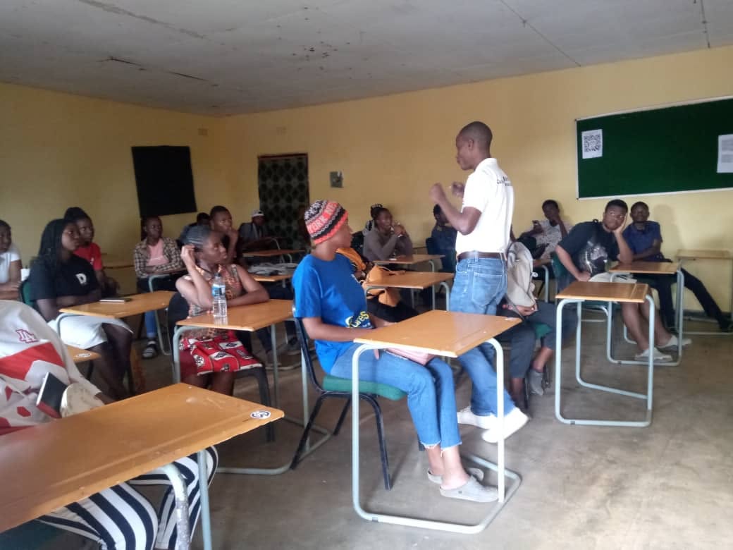 Facilitator speaking to a group of learners